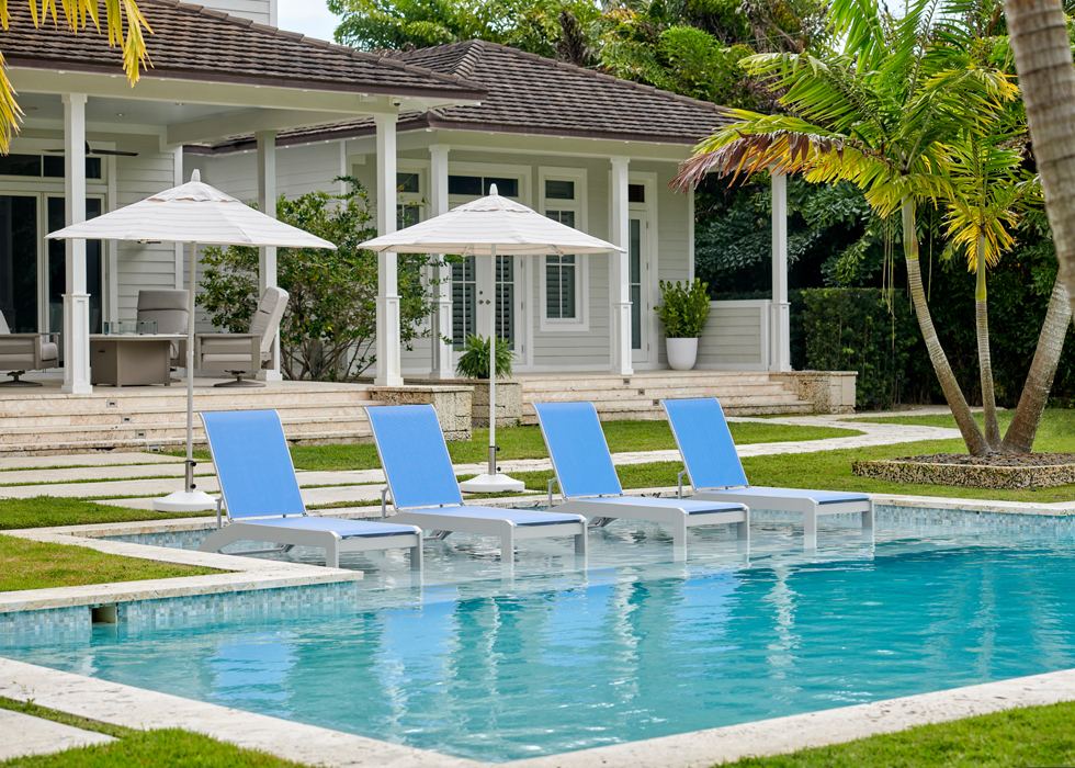 Sling lounge chairs at a resort pool