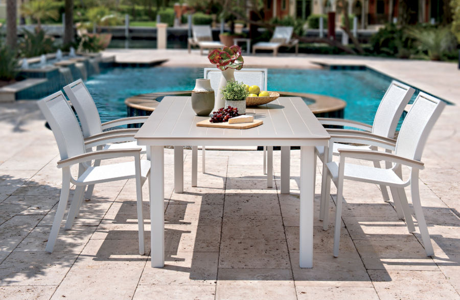 Furniture arranged nicely around a pool